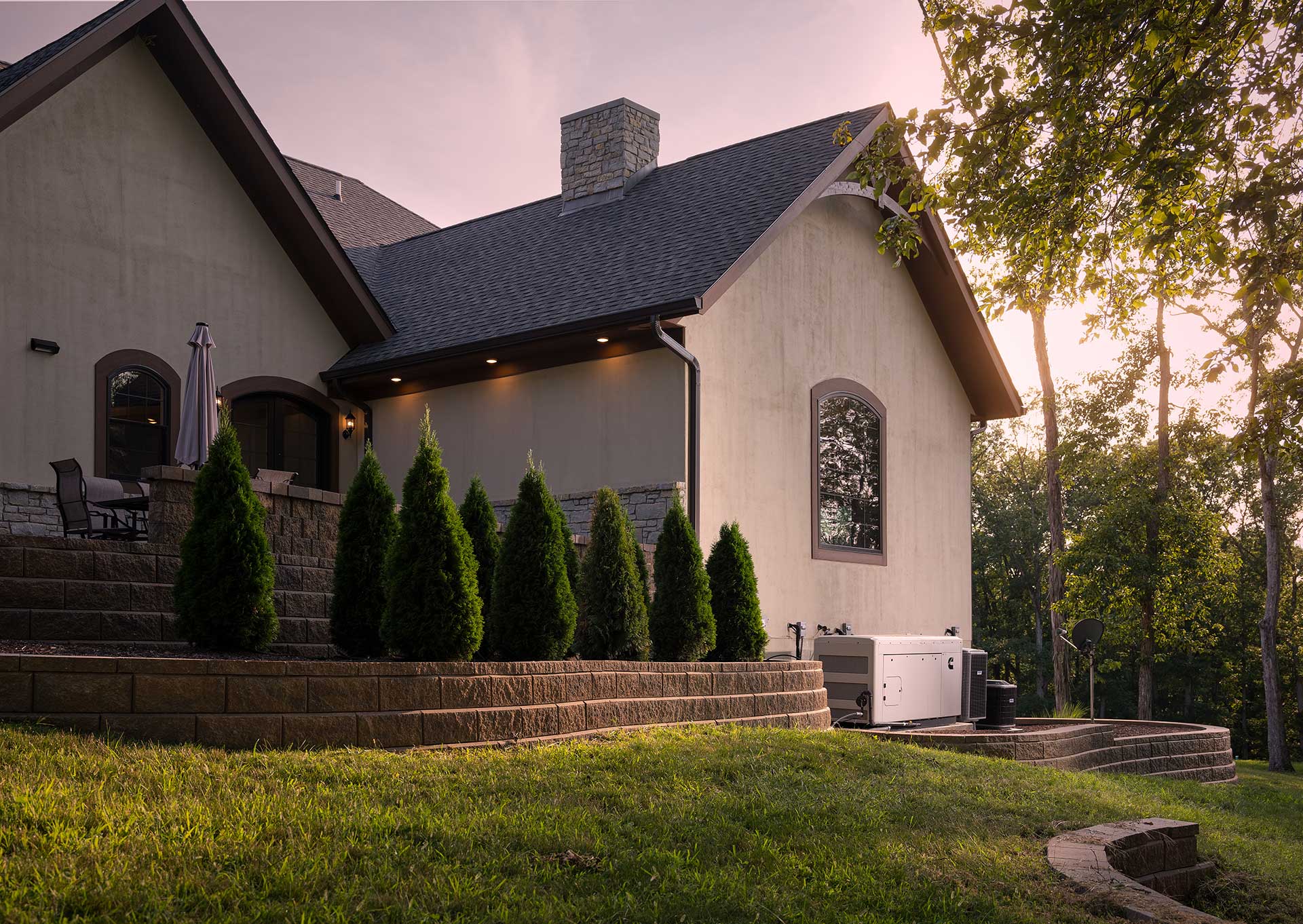 Home at dusk with warm lit windows